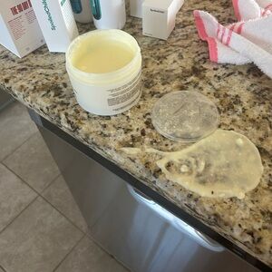 Open Jar of Yellow Cream